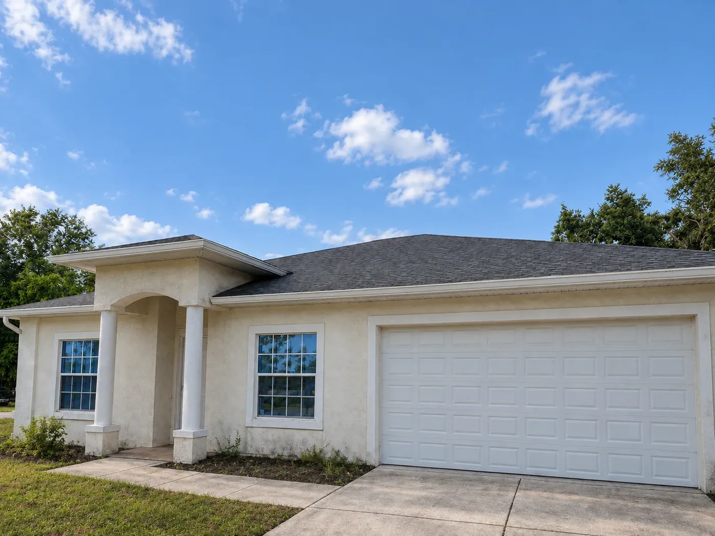Single-storey stucco home before an exterior refresh